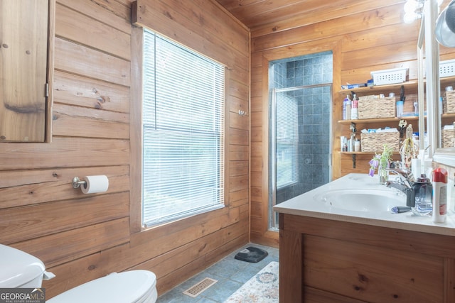 912 Folds Rd, Carrollton, GA 30116 - full bath with toilet, wooden walls, vanity, a shower with shower door, and tile patterned floors