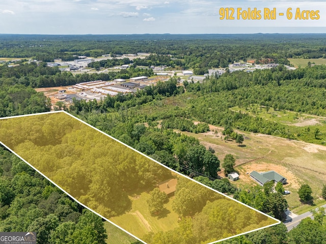 912 Folds Rd, Carrollton, GA 30116 - aerial view of property and surrounding area featuring a heavily wooded area and property boundaries highlighted