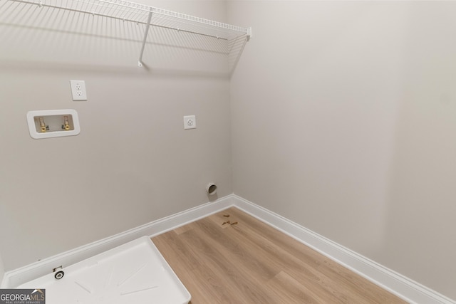 215 Davis Lake Ct Lot 2, Thomaston, GA 30286 - washroom with hookup for an electric dryer, hookup for a washing machine, light wood-style flooring, baseboards, and gas dryer hookup