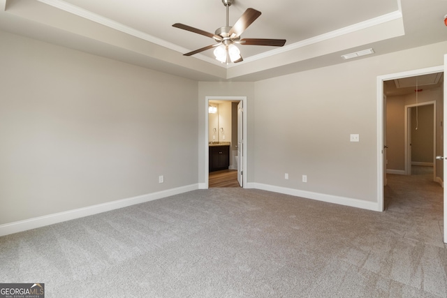 215 Davis Lake Ct Lot 2, Thomaston, GA 30286 - unfurnished room with a tray ceiling, attic access, carpet floors, ceiling fan, and crown molding