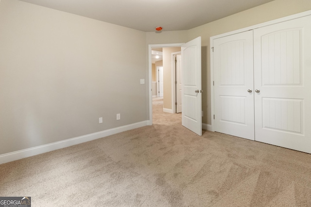 215 Davis Lake Ct Lot 2, Thomaston, GA 30286 - unfurnished bedroom featuring carpet floors, baseboards, and a closet