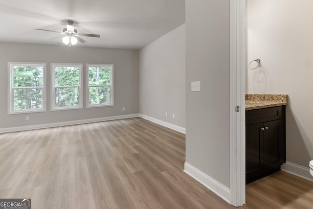 215 Davis Lake Ct Lot 2, Thomaston, GA 30286 - unfurnished living room with plenty of natural light, ceiling fan, light wood-style floors, and baseboards