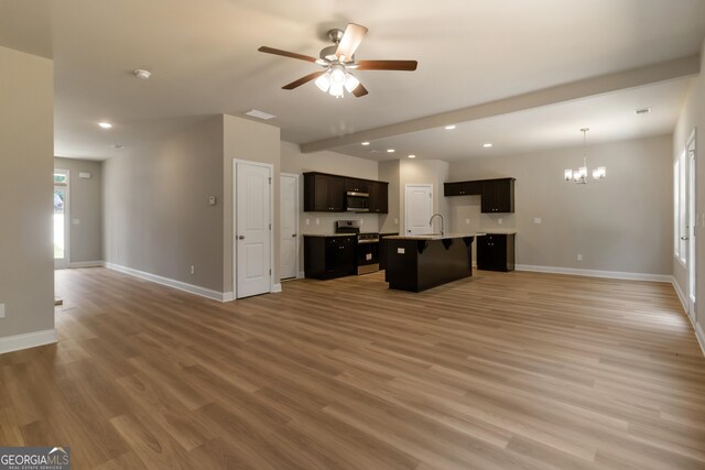 215 Davis Lake Ct Lot 2, Thomaston, GA 30286 - kitchen with open floor plan, stainless steel appliances, a chandelier, baseboards, and recessed lighting