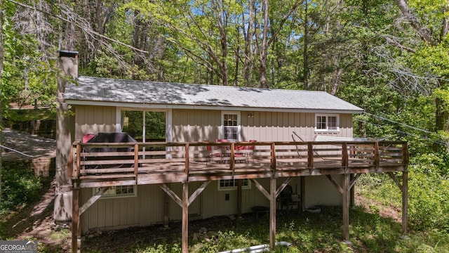 8378 Dillard Rd, Scaly, NC 28775 - back of property with a wooden deck, a chimney, and metal roof