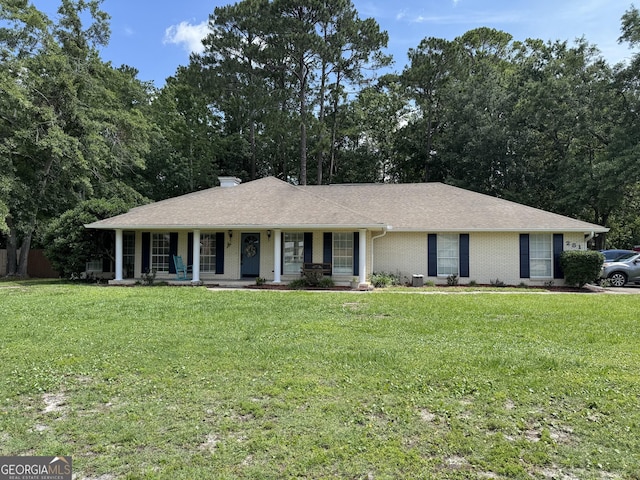 281 Cambridge Cir, Kingsland, GA 31548 - ranch-style house featuring covered porch, a front yard, brick siding, and roof with shingles