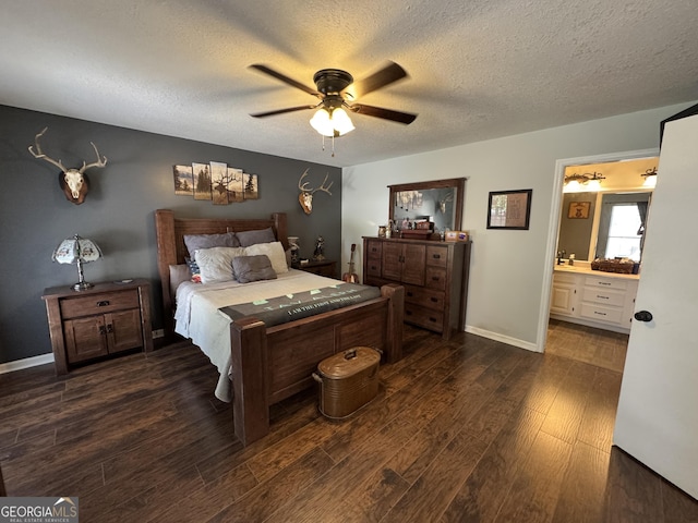 281 Cambridge Cir, Kingsland, GA 31548 - bedroom with dark wood-style floors, a textured ceiling, a ceiling fan, and ensuite bath