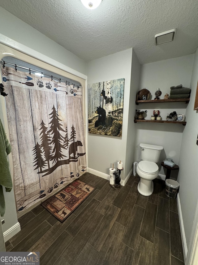 281 Cambridge Cir, Kingsland, GA 31548 - full bathroom with wood finish floors and a textured ceiling