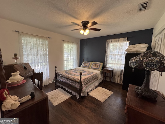 281 Cambridge Cir, Kingsland, GA 31548 - bedroom featuring wood finished floors, a ceiling fan, and a textured ceiling