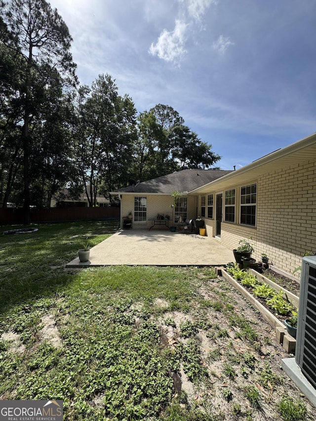 281 Cambridge Cir, Kingsland, GA 31548 - view of yard featuring a patio and a vegetable garden