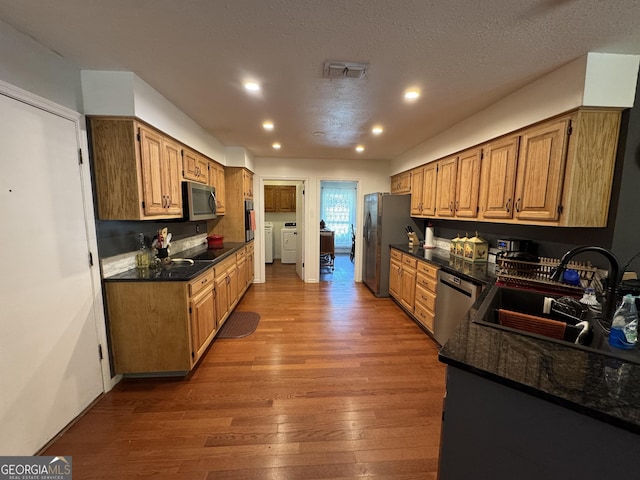 281 Cambridge Cir, Kingsland, GA 31548 - kitchen with appliances with stainless steel finishes, wood finished floors, recessed lighting, and independent washer and dryer