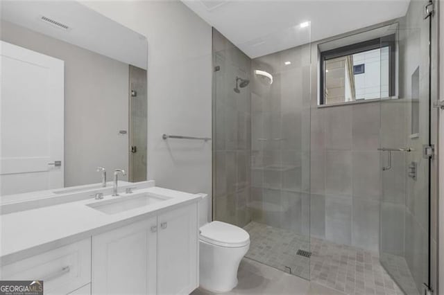 2520 Peachtree Rd Unit 403, Atlanta, GA 30305 - full bath featuring toilet, vanity, and a shower stall