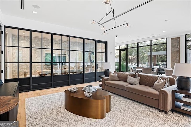 2520 Peachtree Rd Unit 403, Atlanta, GA 30305 - living area featuring wood finished floors, recessed lighting, a chandelier, and expansive windows
