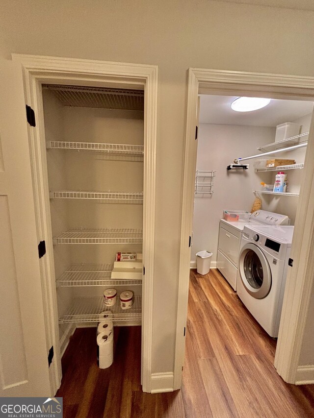 523 Huntleigh Dr, Winder, GA 30680 - washroom featuring washing machine and dryer, wood finished floors, and baseboards