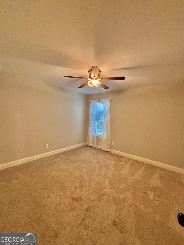 523 Huntleigh Dr, Winder, GA 30680 - unfurnished room featuring carpet, a ceiling fan, and baseboards