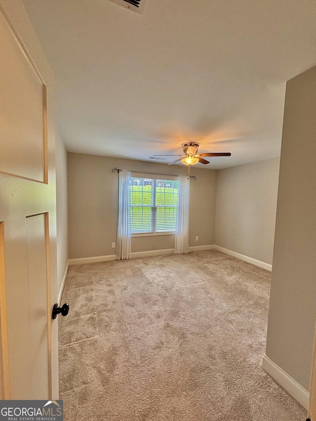 523 Huntleigh Dr, Winder, GA 30680 - carpeted empty room featuring a ceiling fan and baseboards