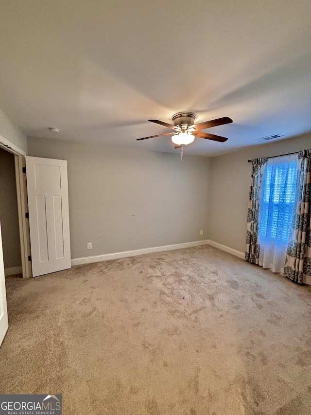 523 Huntleigh Dr, Winder, GA 30680 - spare room featuring carpet, a ceiling fan, and baseboards