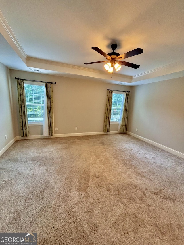 523 Huntleigh Dr, Winder, GA 30680 - carpeted empty room with a raised ceiling, a ceiling fan, ornamental molding, and baseboards