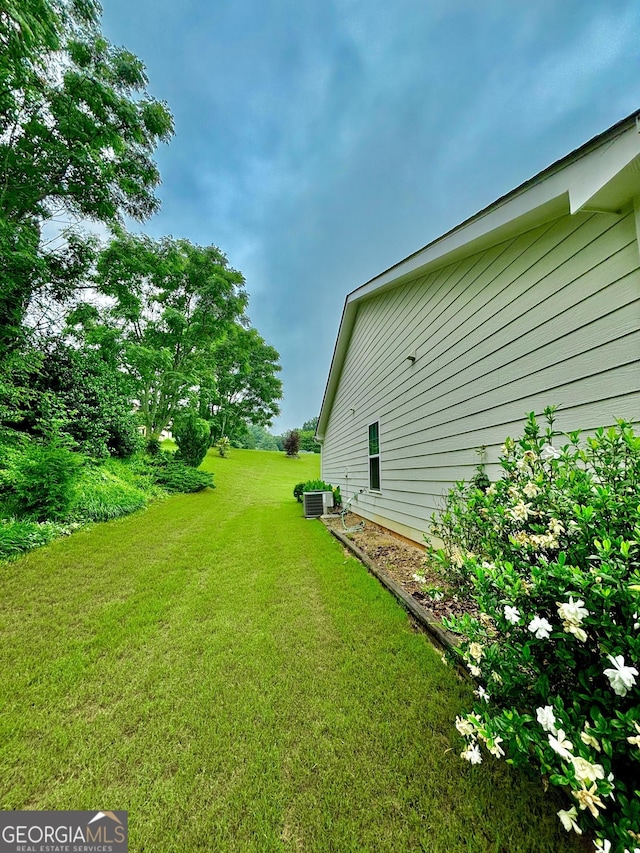 523 Huntleigh Dr, Winder, GA 30680 - view of grassy yard with central AC unit