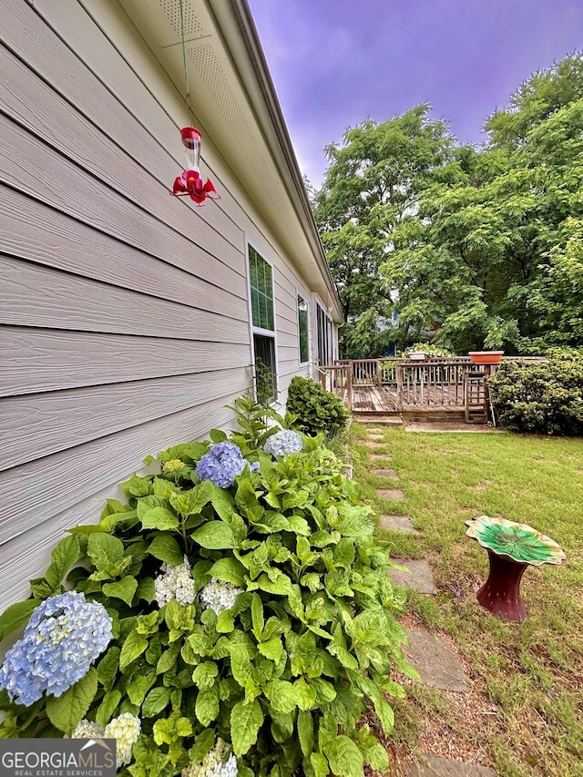 523 Huntleigh Dr, Winder, GA 30680 - view of grassy yard featuring a deck