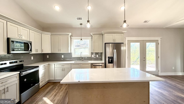 270 Meadow Crest Dr, Cleveland, GA 30528 - kitchen with stainless steel appliances, a sink, decorative backsplash, french doors, and lofted ceiling