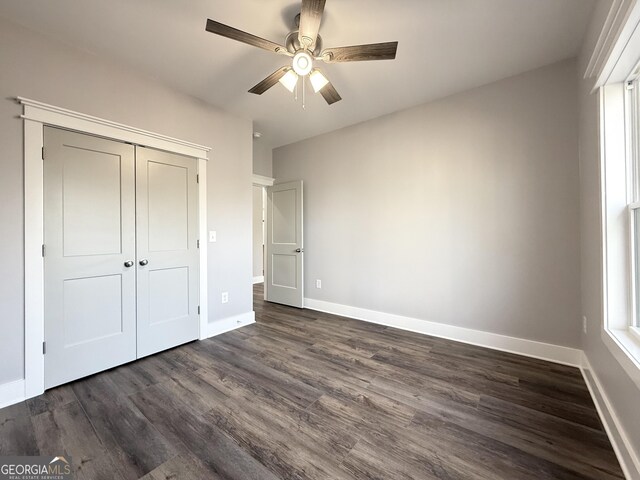 270 Meadow Crest Dr, Cleveland, GA 30528 - unfurnished bedroom with dark wood-style floors, baseboards, a closet, and a ceiling fan