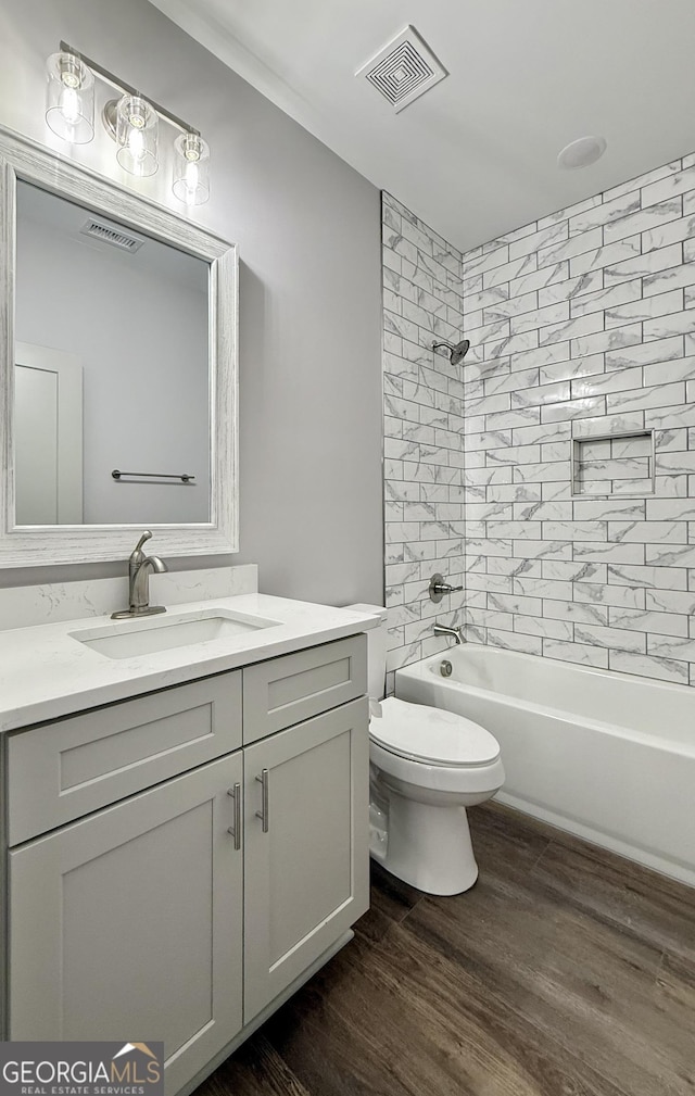 270 Meadow Crest Dr, Cleveland, GA 30528 - full bath featuring vanity, wood finished floors, toilet, and tub / shower combination
