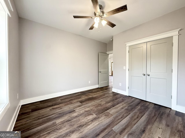 270 Meadow Crest Dr, Cleveland, GA 30528 - unfurnished bedroom with dark wood-style floors, a closet, baseboards, and ceiling fan
