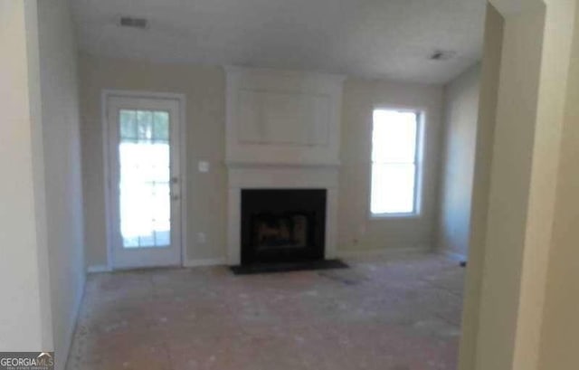 2918 Egret Ln, Austell, GA 30106 - unfurnished living room with a fireplace and baseboards