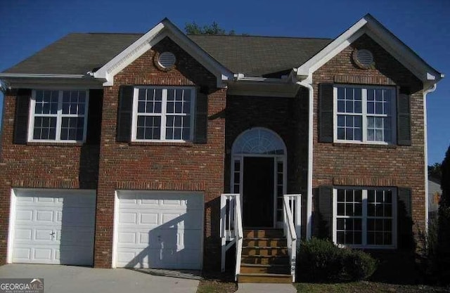 2918 Egret Ln, Austell, GA 30106 - view of front of house with brick siding, a garage, and concrete driveway