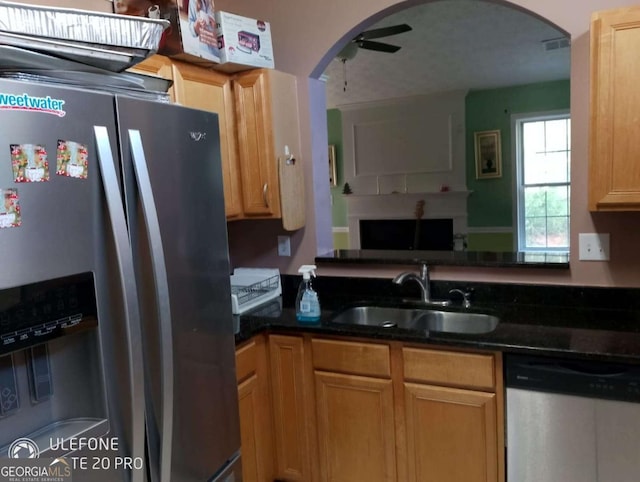 2918 Egret Ln, Austell, GA 30106 - kitchen featuring stainless steel appliances, a sink, arched walkways, open floor plan, and ceiling fan