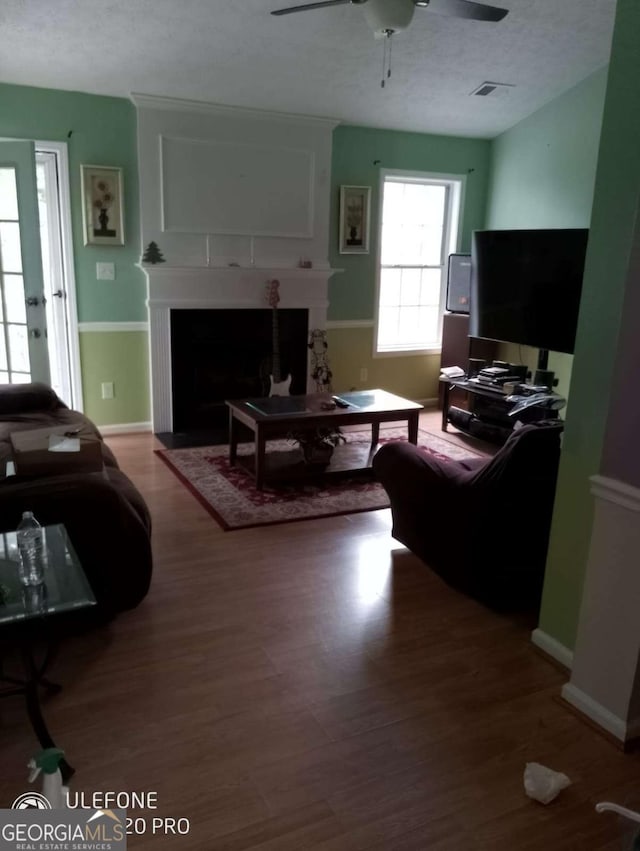 2918 Egret Ln, Austell, GA 30106 - living area with a large fireplace, wood finished floors, and a ceiling fan