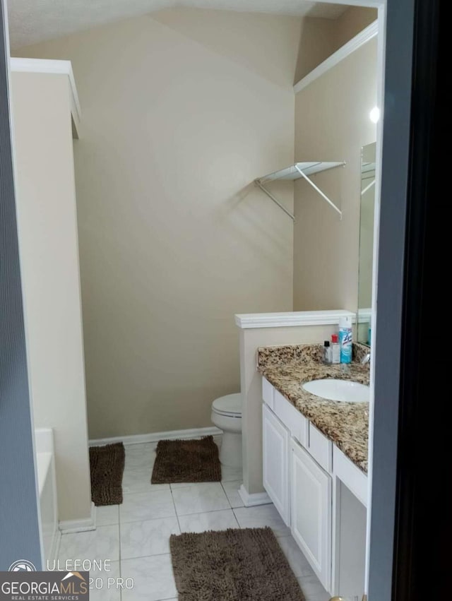 2918 Egret Ln, Austell, GA 30106 - full bathroom featuring vanity, toilet, and baseboards