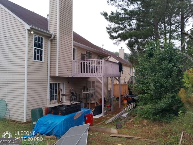 2918 Egret Ln, Austell, GA 30106 - rear view of property with a chimney and a balcony