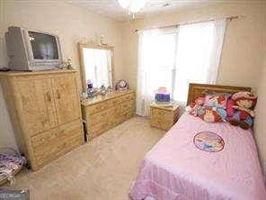2918 Egret Ln, Austell, GA 30106 - bedroom featuring carpet floors and ceiling fan