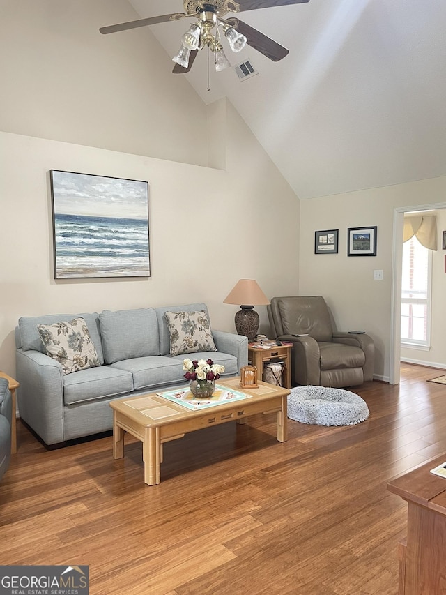 205 Ellicott Dr, Warner Robins, GA 31088 - living room featuring ceiling fan, light wood finished floors, baseboards, and high vaulted ceiling