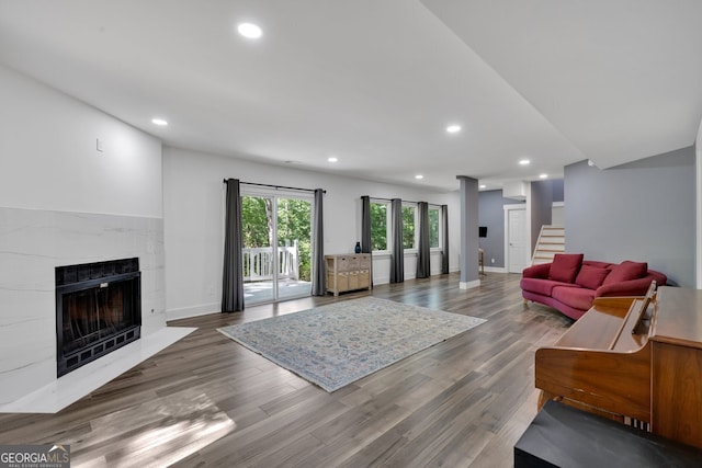 510 Watergate Ct, Roswell, GA 30076 - living room featuring stairs, a fireplace, recessed lighting, wood finished floors, and baseboards