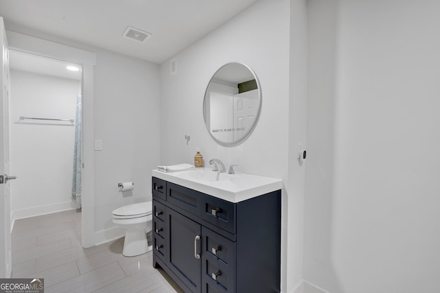 510 Watergate Ct, Roswell, GA 30076 - bathroom with vanity, toilet, and baseboards
