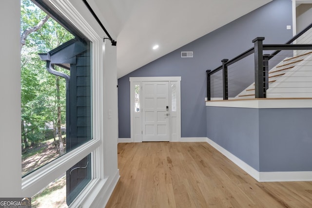 510 Watergate Ct, Roswell, GA 30076 - entrance foyer featuring wood finished floors, lofted ceiling, and stairway