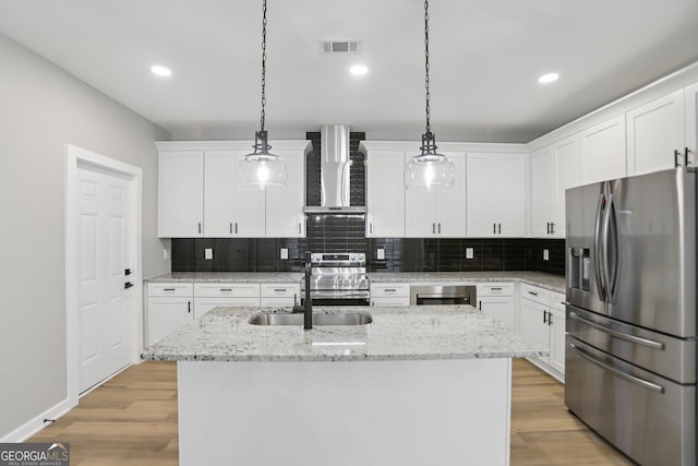 3189 Jackson Unit A, Hapeville, GA 30354 - kitchen featuring stainless steel appliances, wall chimney range hood, decorative backsplash, white cabinetry, and recessed lighting