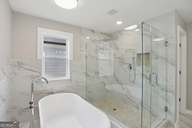 3189 Jackson Unit A, Hapeville, GA 30354 - bathroom featuring a marble finish shower, a freestanding tub, recessed lighting, and tile walls