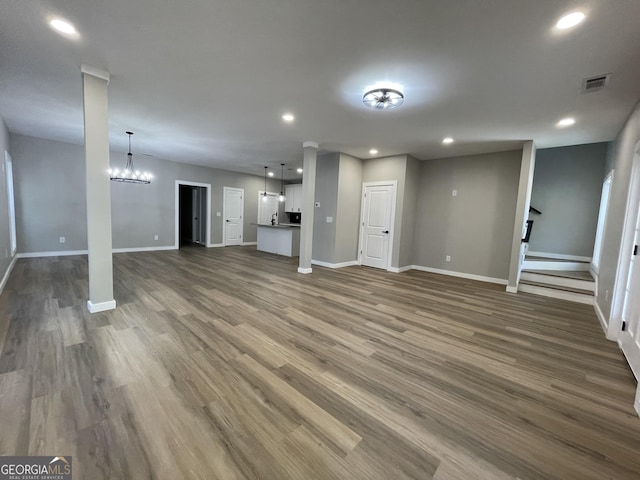 3189 Jackson Unit A, Hapeville, GA 30354 - unfurnished living room featuring baseboards, recessed lighting, a chandelier, and dark wood-style floors