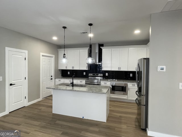 3189 Jackson Unit A, Hapeville, GA 30354 - kitchen featuring appliances with stainless steel finishes, wall chimney exhaust hood, a sink, white cabinetry, and recessed lighting