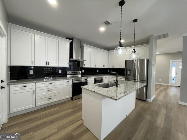 3189 Jackson Unit A, Hapeville, GA 30354 - kitchen with appliances with stainless steel finishes, wall chimney exhaust hood, a sink, decorative backsplash, and white cabinets