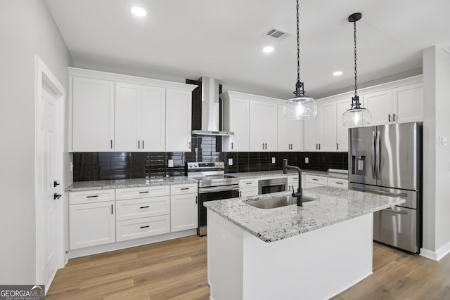 3189 Jackson Unit A, Hapeville, GA 30354 - kitchen with stainless steel appliances, wall chimney exhaust hood, light wood finished floors, white cabinetry, and recessed lighting