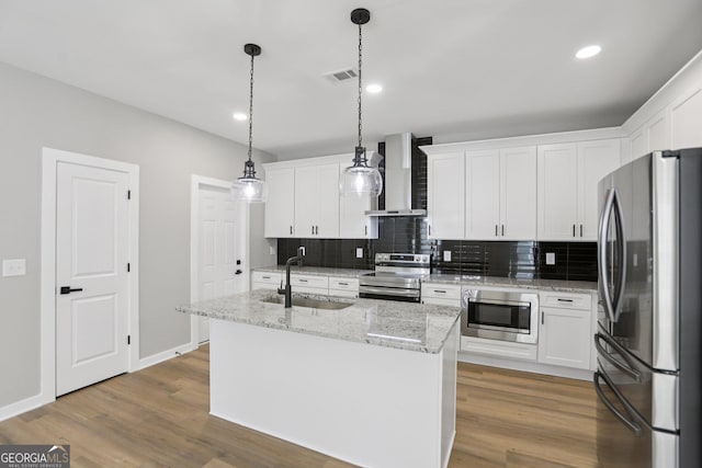 3189 Jackson Unit A, Hapeville, GA 30354 - kitchen featuring stainless steel appliances, wall chimney exhaust hood, decorative backsplash, white cabinets, and recessed lighting