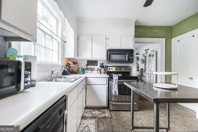331 Corbin Ave, Macon, GA 31204 - kitchen with black appliances, a sink, light countertops, white cabinetry, and stone finish flooring