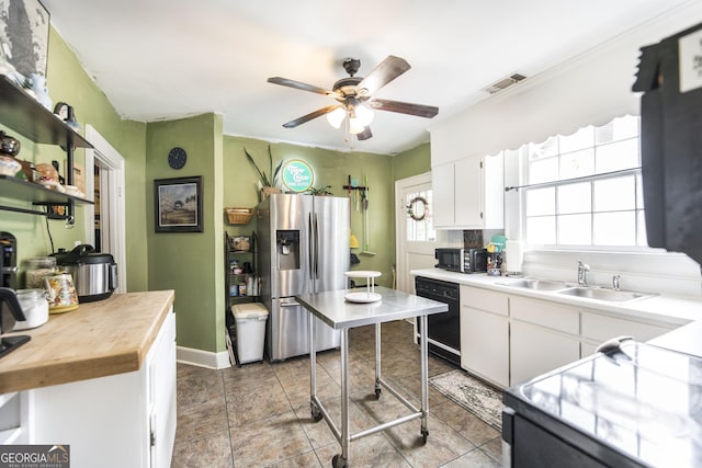 331 Corbin Ave, Macon, GA 31204 - kitchen with black appliances, a ceiling fan, white cabinetry, and wood counters