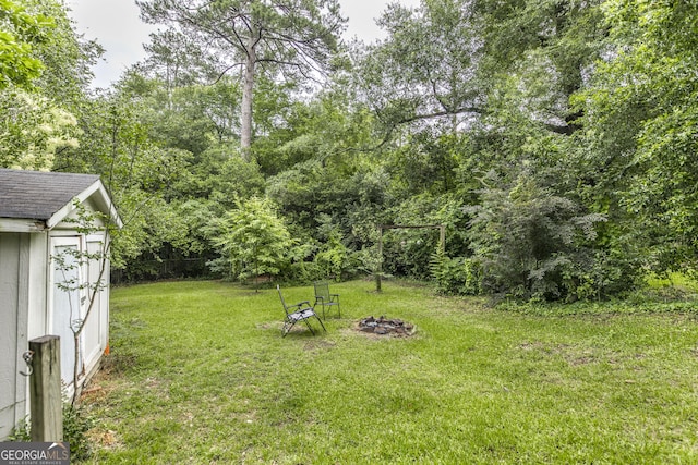 331 Corbin Ave, Macon, GA 31204 - view of green lawn featuring an outdoor fire pit