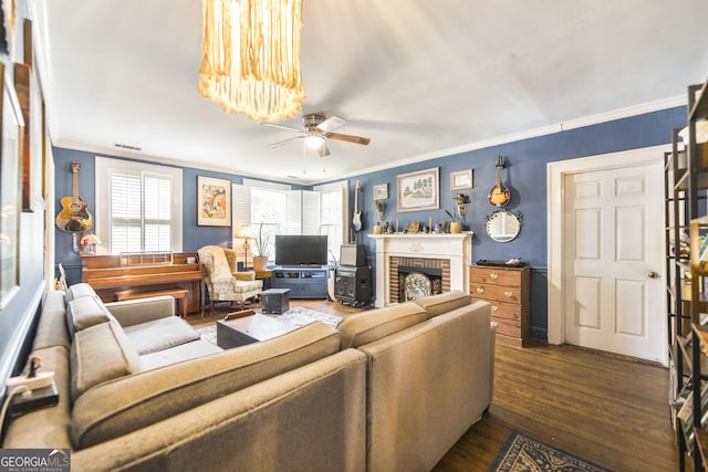 331 Corbin Ave, Macon, GA 31204 - living room with crown molding, a ceiling fan, dark wood-style floors, and a fireplace