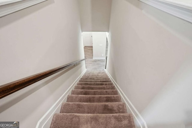 106 Logan Pass Dr, Loganville, GA 30052 - stairs featuring baseboards and carpet flooring